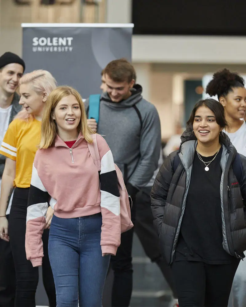Students walking in the Spark atrium