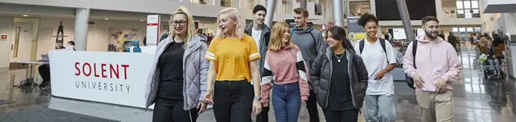 A group of students walking through the Spark