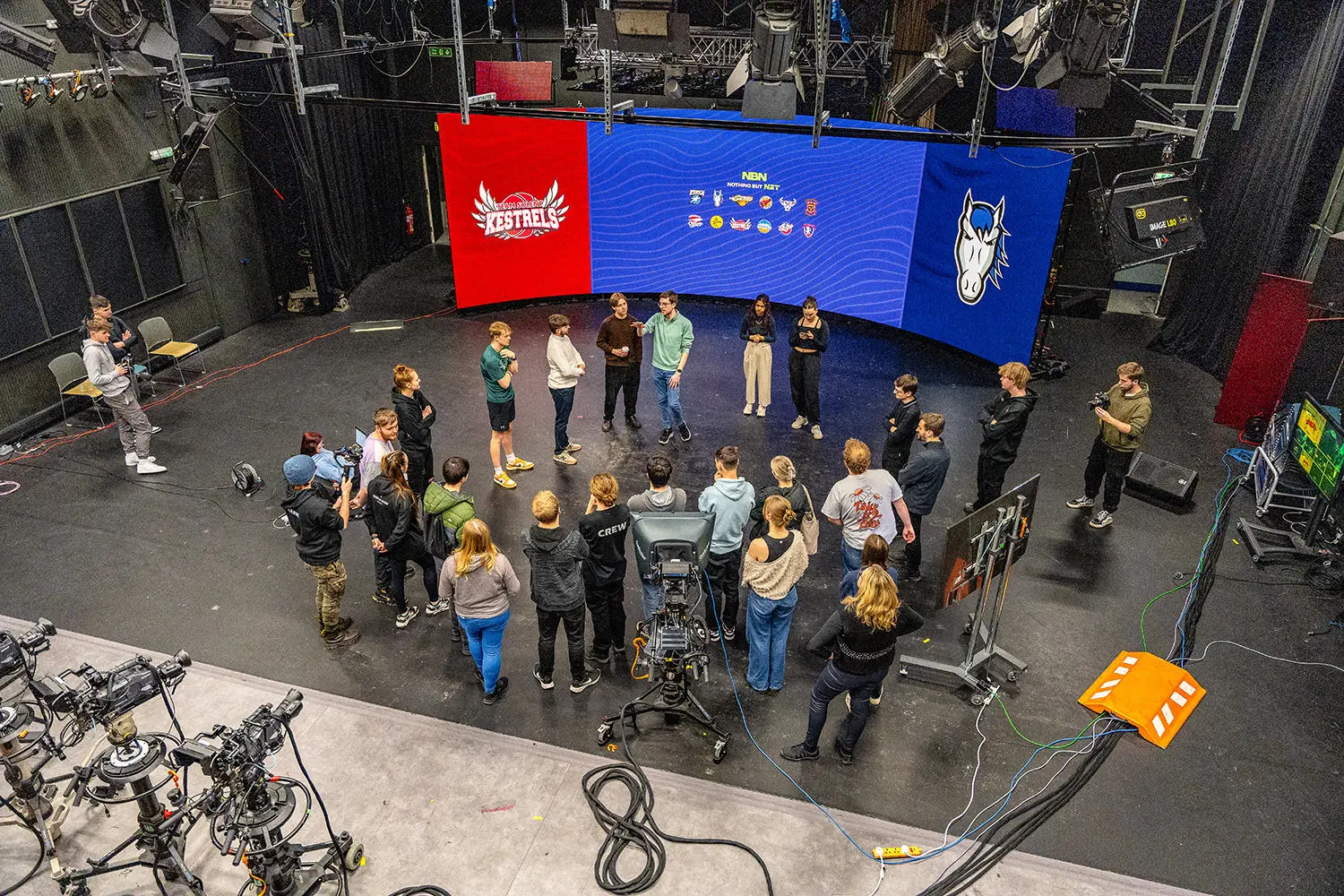 Image shows team of students in front of the VP screen