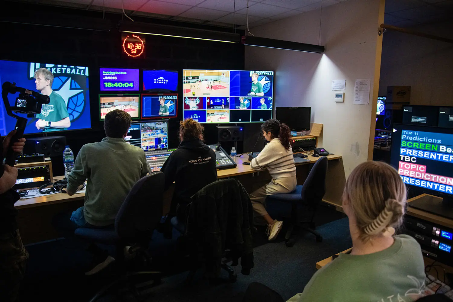 Image shows team of students working on live streaming the event