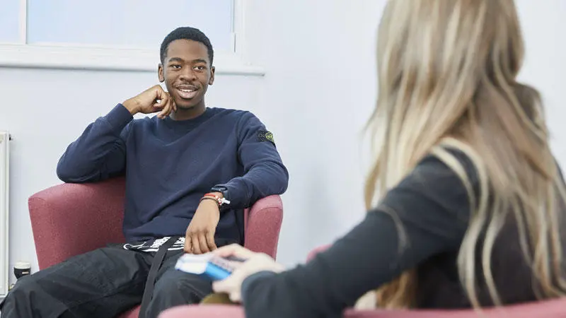 Two social work students talking to each other