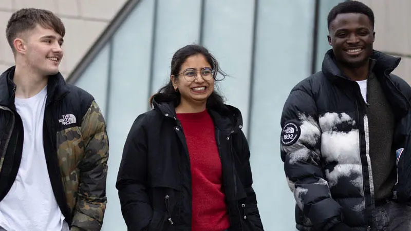 Three students walking in Southampton