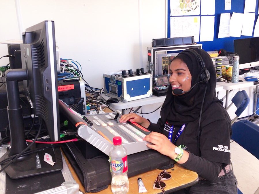 Aaliyah working the controls at the desk