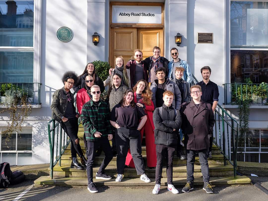 the crew and band outside abbey road studios