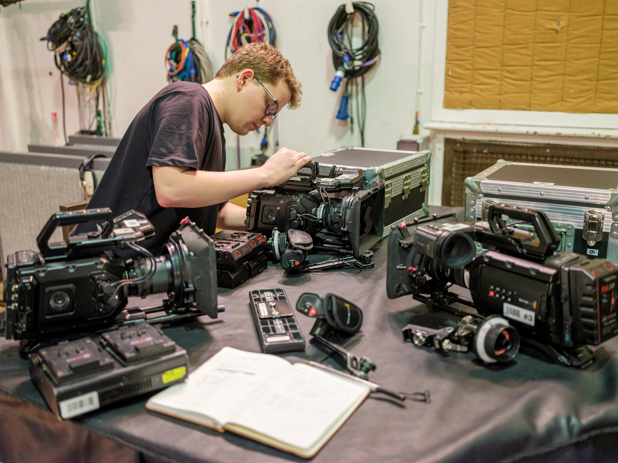 student setting up camera equipment 