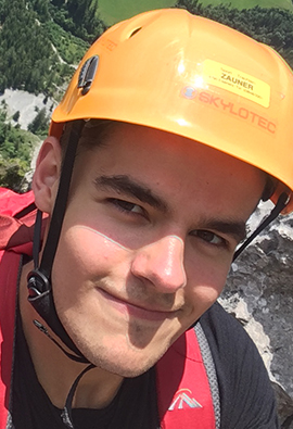 Solent student, Riley, wearing a yellow safety helmet