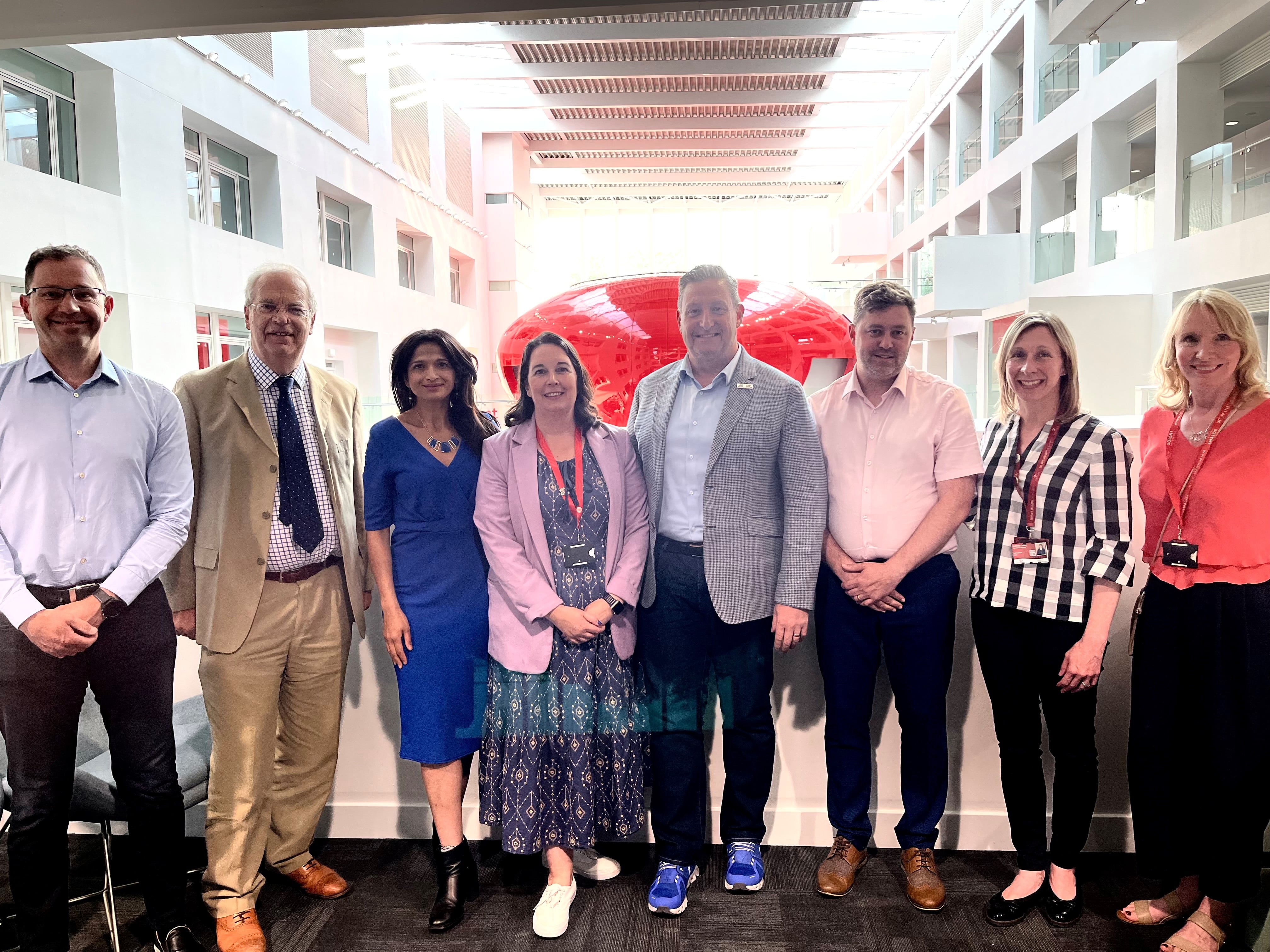 Members of the Business Advisory Board in front of the Pod in the Spark Atrium