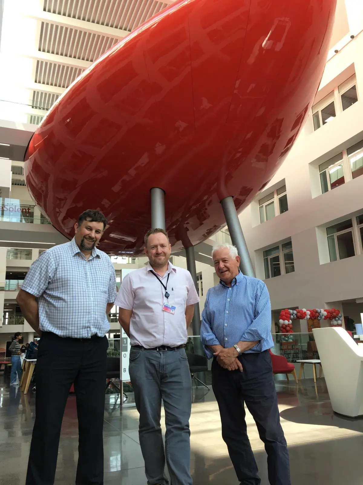 L-R: Daniel Singleton (FaithAction), Daniel Inns (Solent University), and David Vane (Southampton Council of Faiths) in front of the Pod in the Spark building at Solent University.