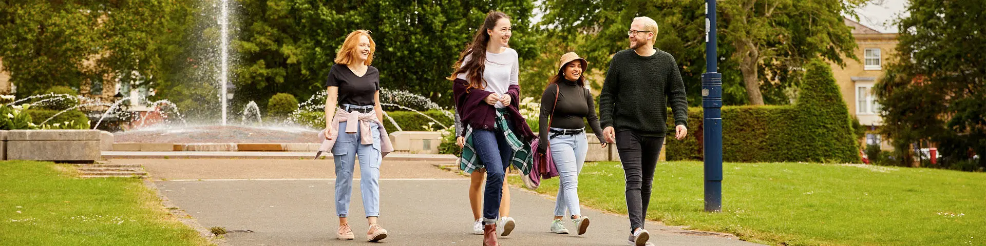 A group of people walking in the park.