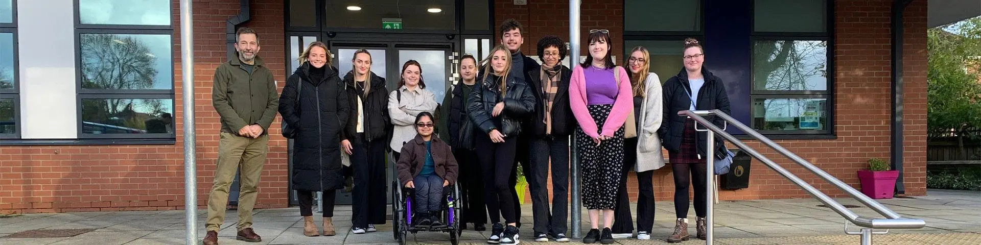 Education students together outside Banister Primary School.