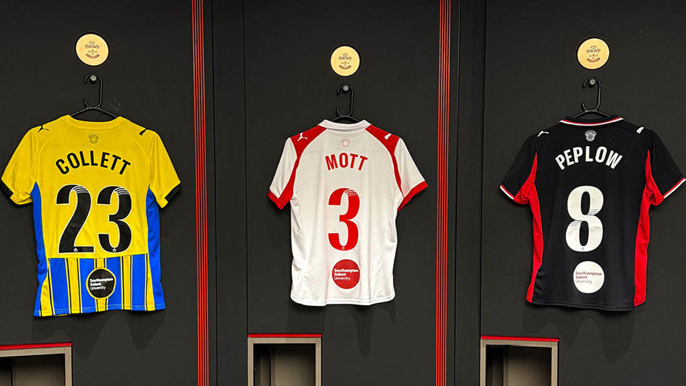 Three Southampton FC shirts hanging up in the changing room