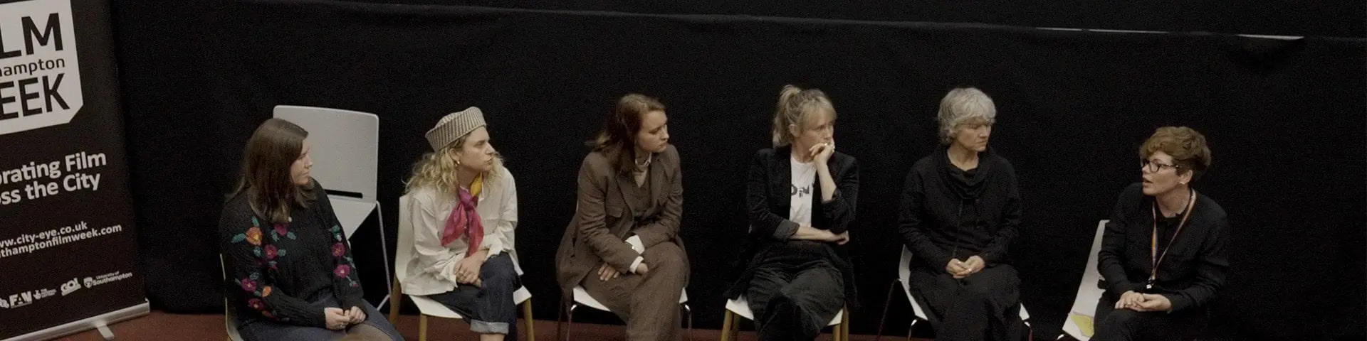 Six women sat together for a panel discussion.