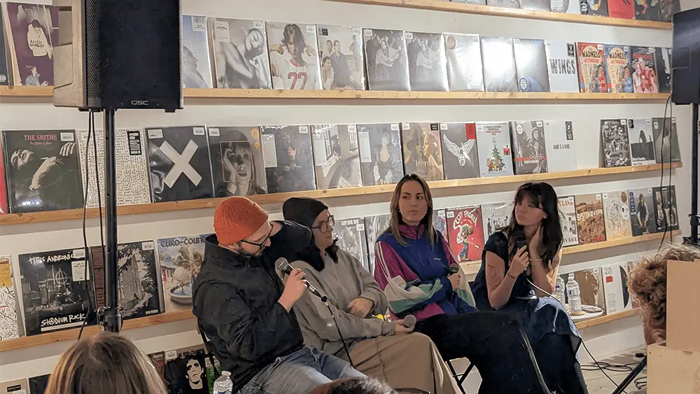 A panel of speakers at an event.