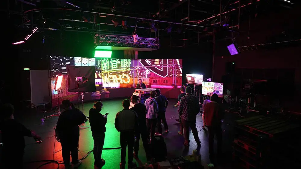 Students standing together in front of the Virtual Production Stage 