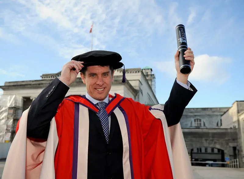 Dr Paul Hawkins with his honorary degree from Solent University