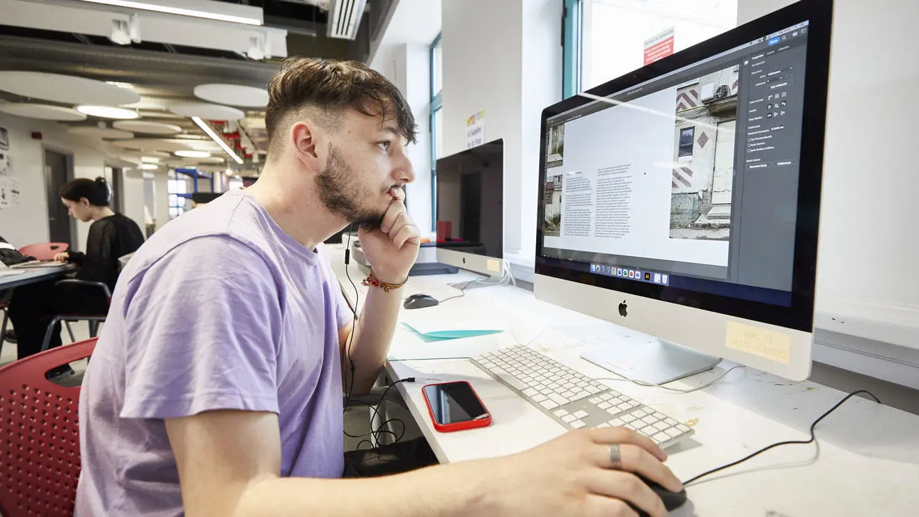 A graphic design student working on a project