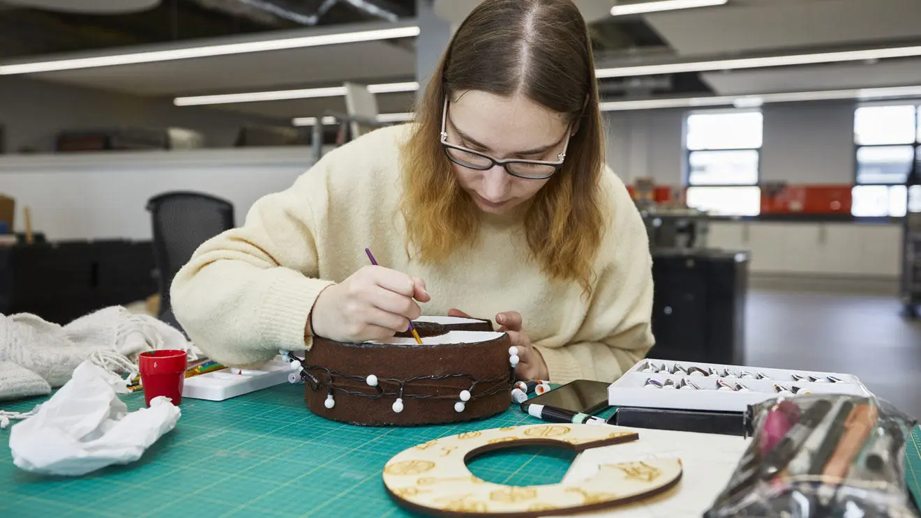 An art student working on a project