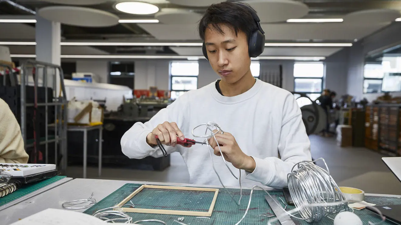 An art student working on a project