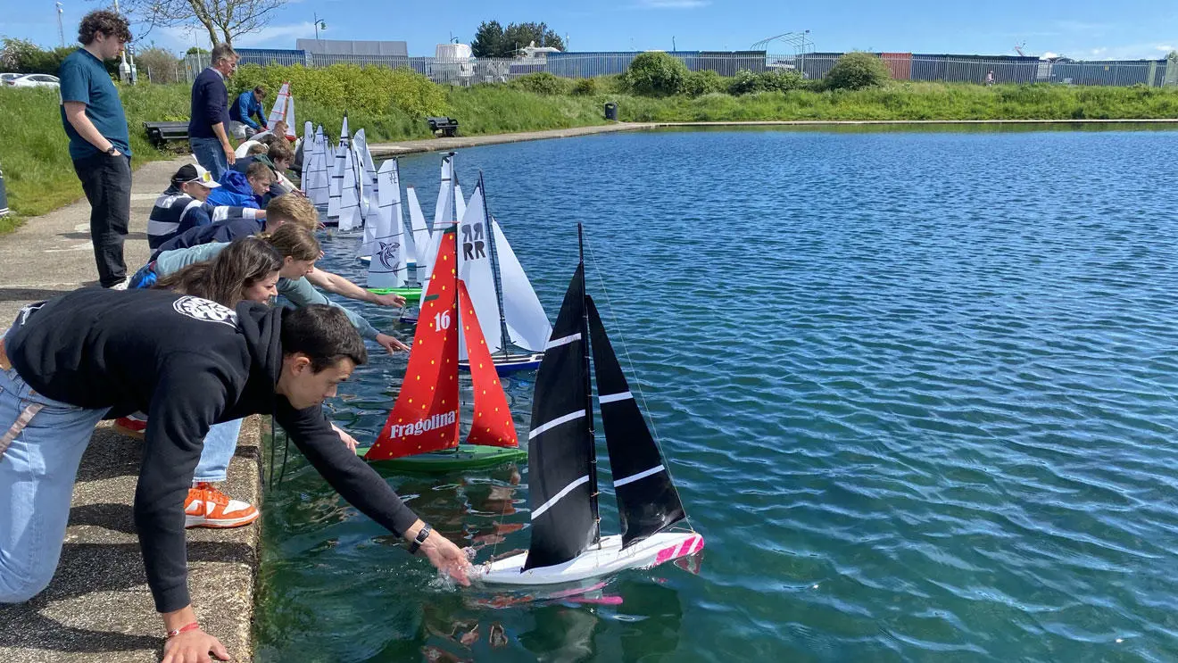 Yacht engineering students at the lake