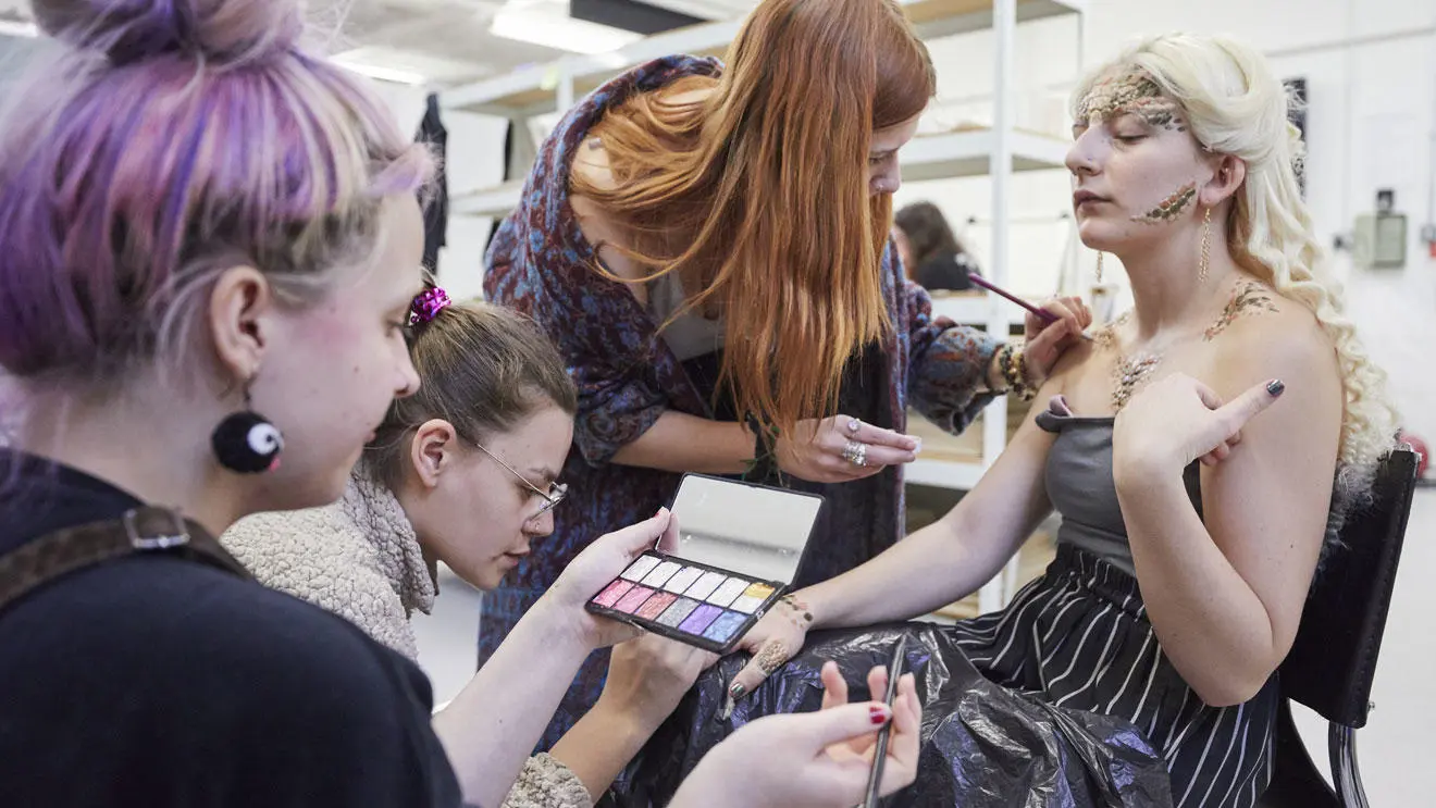 Prosthetics students working on a model