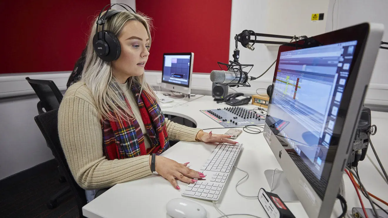 A media student in the radio studio