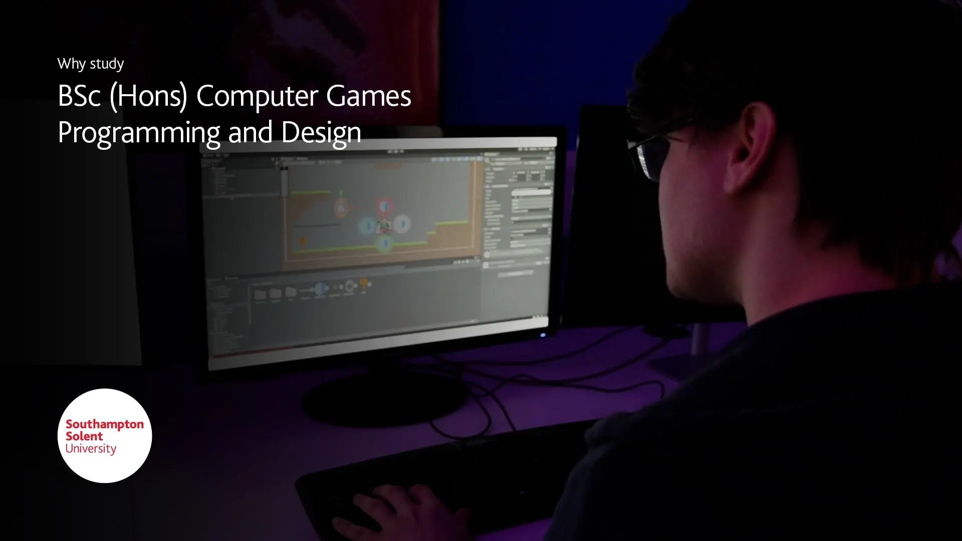 Image of a student working on a computer designing a computer game