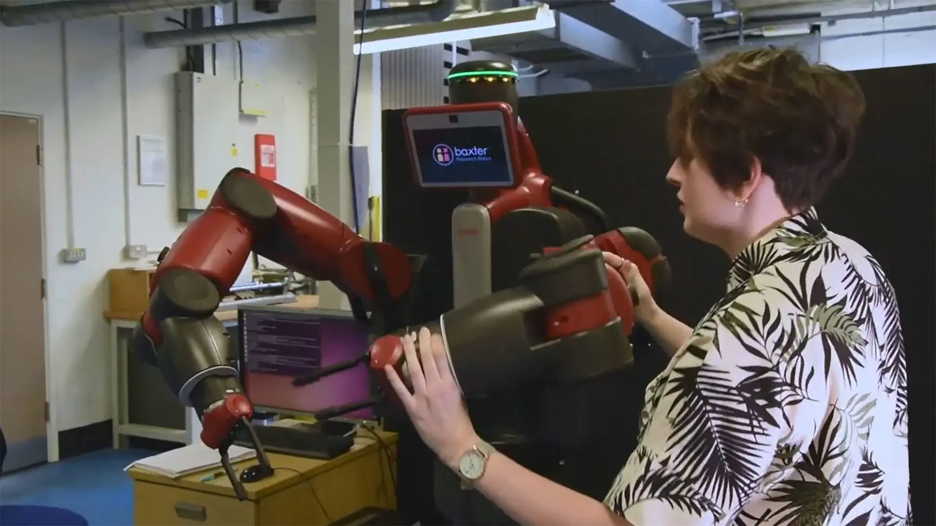 A Solent student using the Baxter robot