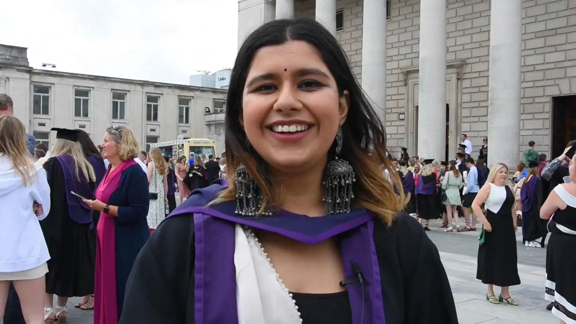A Solent graduate stood in front of the Guildhall