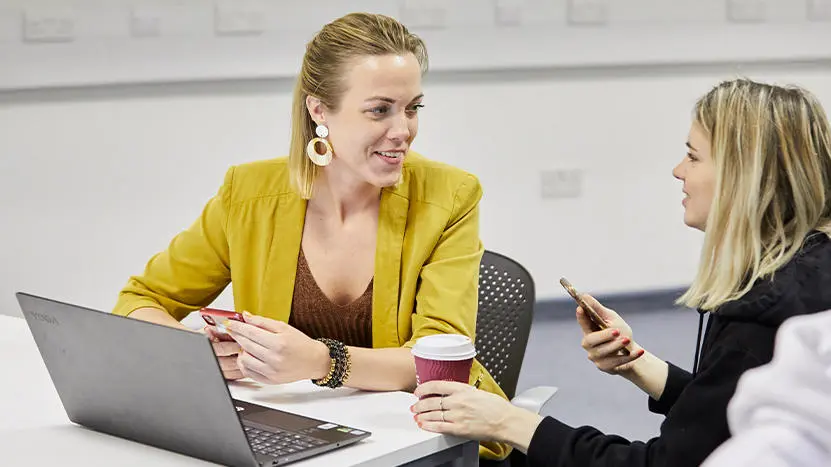 Two people working together in a professional setting