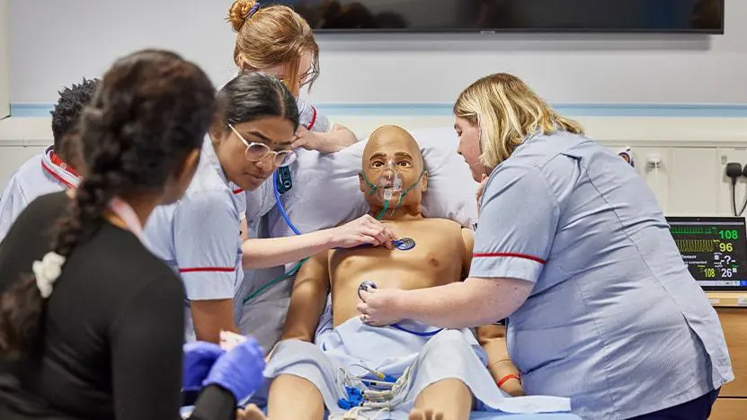 Image of health professionals working in a nursing simulation suite