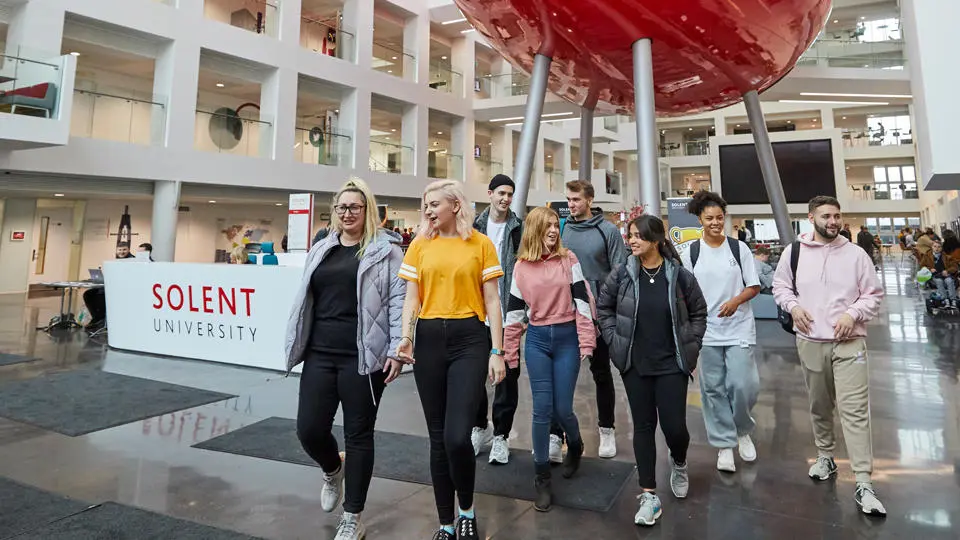 Solent students walking in The Spark