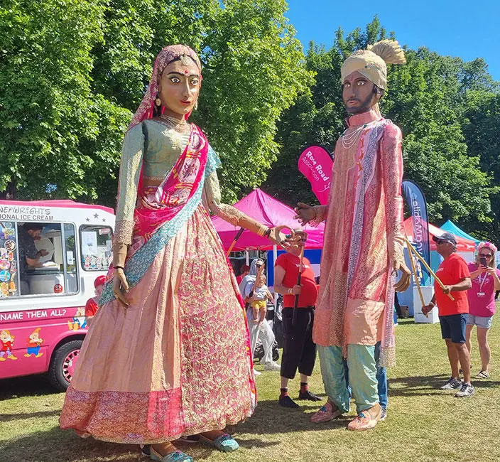 Two giant models at the Southampton Mela Festival