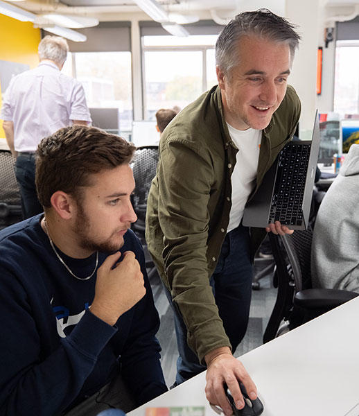 A lecturer working with a student