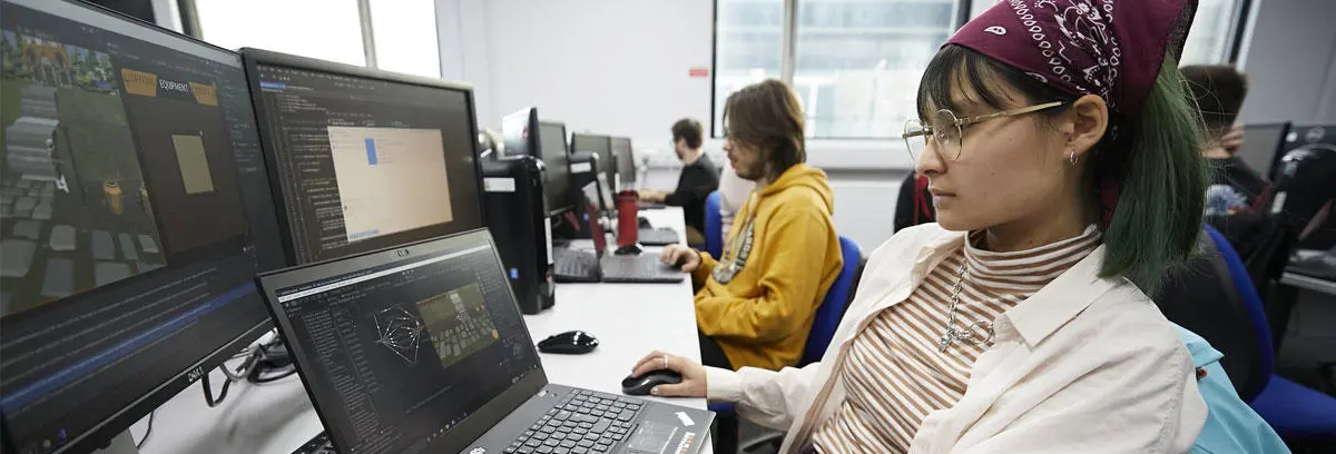 A computer games student working in the lab