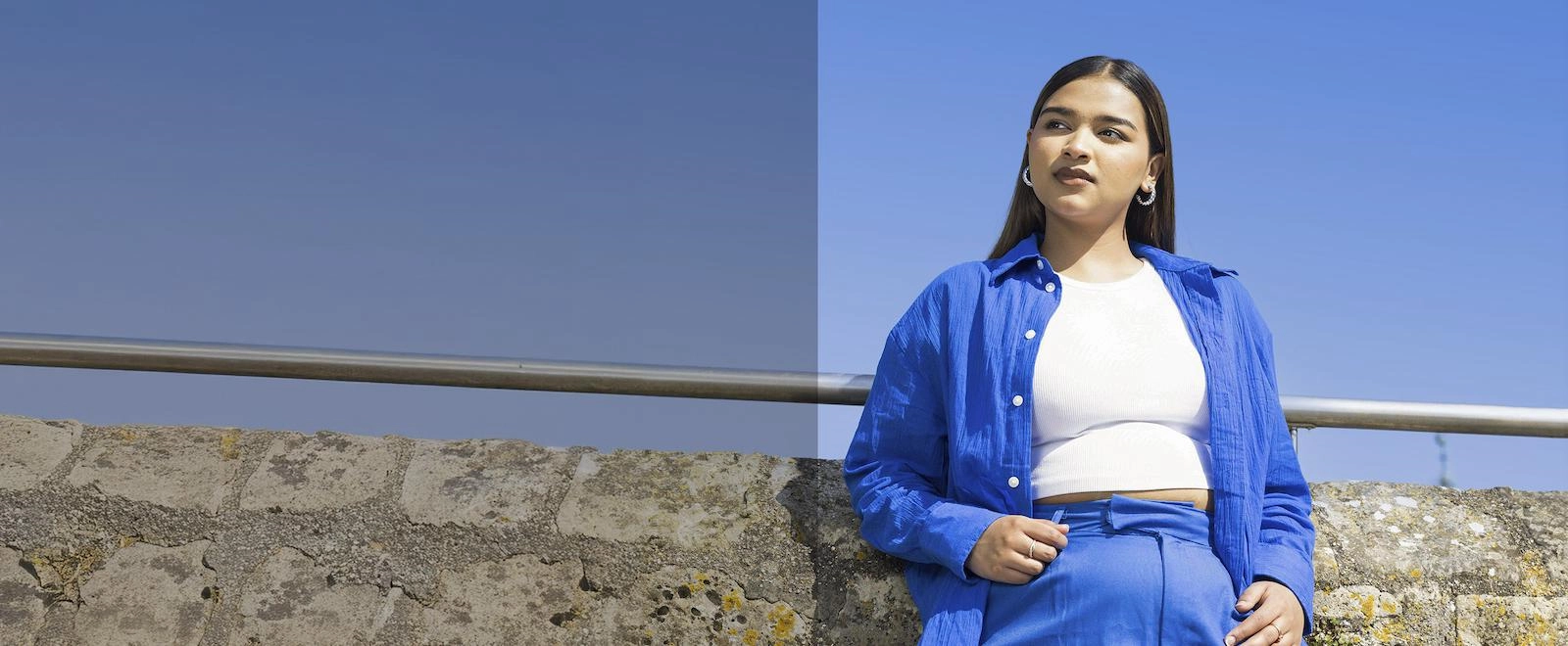 Solent student stood against a blue sky