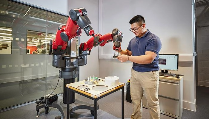 A student using Baxter the robot
